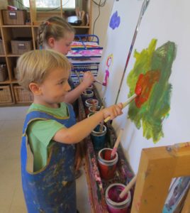 Kids painting in the studio